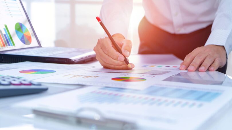 Businessman In Office Analyzing Researching Strategizing Finances Return On Investment