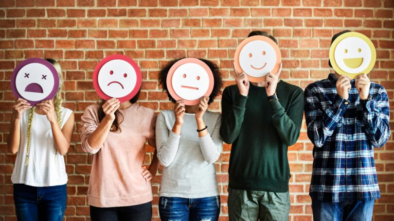 Students Portraying Different Emotions Covering Face