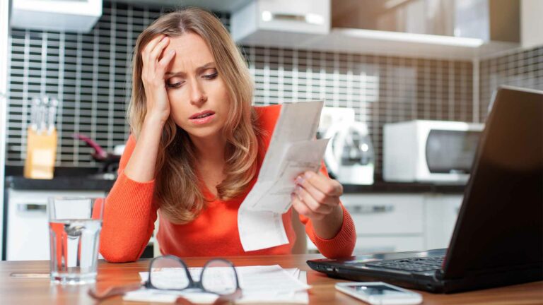 stressed young woman doing banking administrative tasks