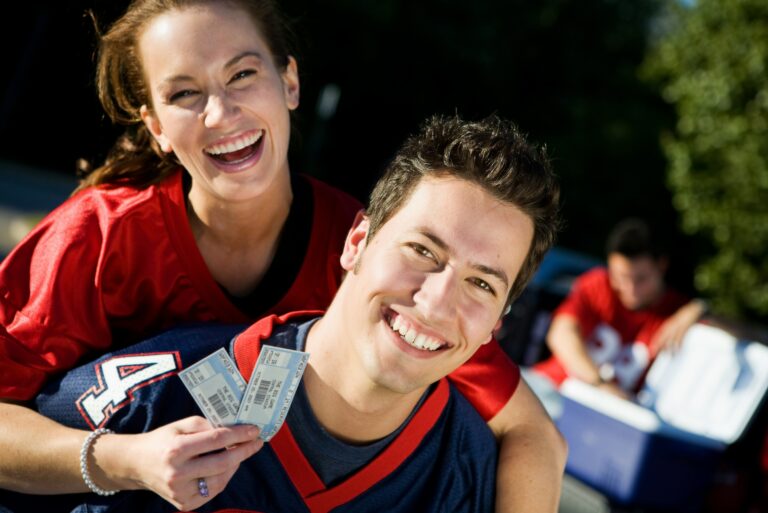 Couple Holding Sports Tickets