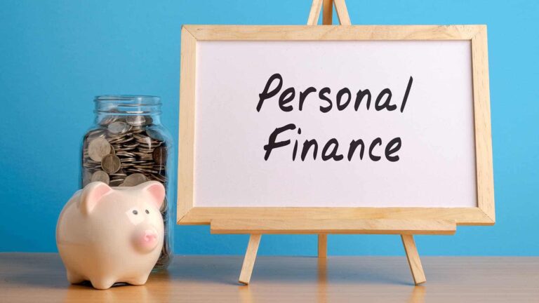 piggy bank beside whiteboard personal finance