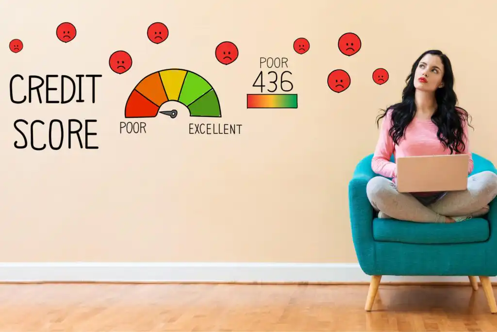 A woman with a laptop sits on a teal chair, looking at a credit score gauge on the wall showing a poor score of 436, surrounded by sad face icons.