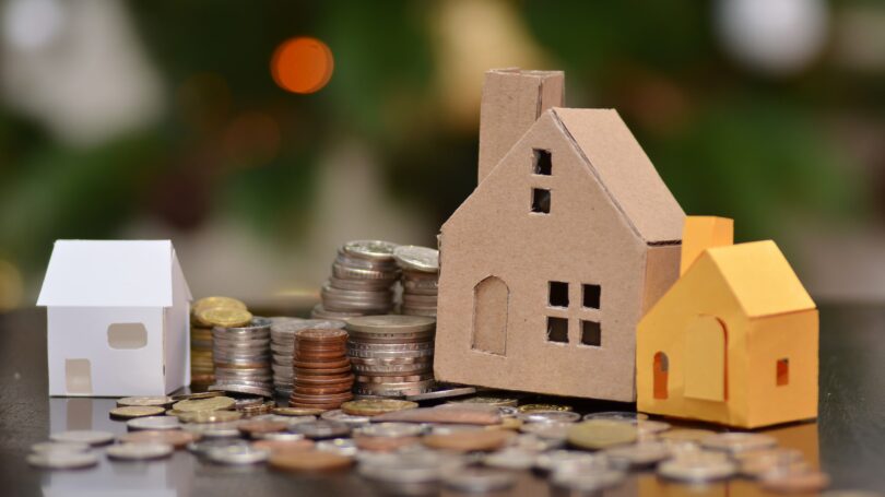 Cardboard Houses On Stacked Coins Tax Loan – Money Crashers Cardboard Houses On Stacked Coins Tax Loan