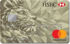 A gold HSBC Mastercard credit card featuring a geometric lion design, embossed numbers, chip, and the HSBC and Mastercard logos. The name “John Q Sample” is printed at the bottom left.