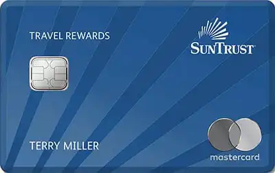 A blue SunTrust Mastercard credit card with Travel Rewards, a chip, the Mastercard logo, and the name TerrY Miller printed on the front.
