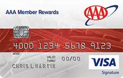 A AAA Member Rewards Visa Signature credit card featuring a red and white design, a chip, the AAA logo, card number, expiration date, cardholder name, and the Visa logo.