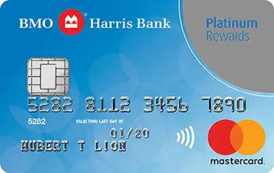 A BMO Harris Bank Platinum Rewards Mastercard credit card with a blue background, chip, contactless symbol, and Mastercard logo. Cardholder name HUBERT T LION and card number are visible.