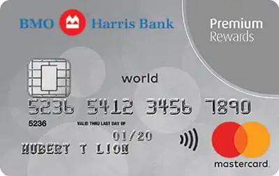 A BMO Harris Bank Premium Rewards Mastercard credit card with a silver background, chip, and contactless symbol. The cardholder name is HUBERT T LION and the expiry date is 01/20. The Mastercard logo is in the bottom right.