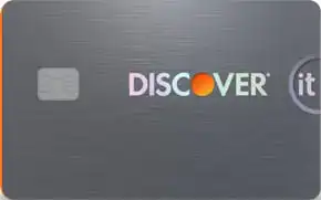 A Discover it credit card with a metallic gray background, featuring the Discover logo in the center and an embedded chip on the left side.