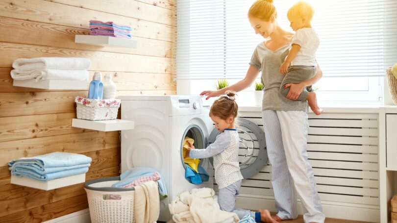 Young Daughter Girl Helping With Laundry