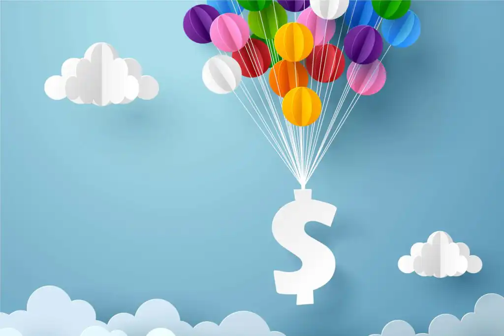 A cluster of colorful balloons lifts a large white dollar sign into a blue sky with scattered white clouds in a paper-cut art style.