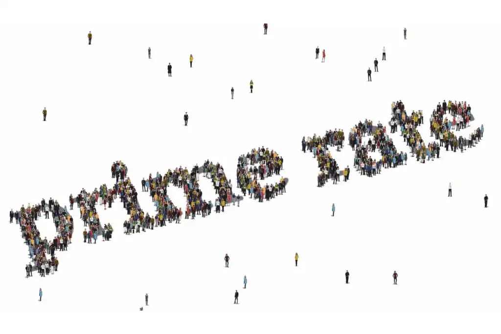 A large group of people are arranged to form the words prime rate on a white background, with additional scattered individuals standing around the formation.