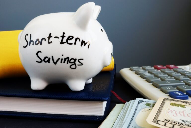 Short Term Savings. Piggy Bank, Calculator And Money.