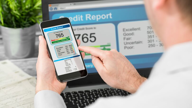 Man Monitoring His Credit Report Score Phone Computer