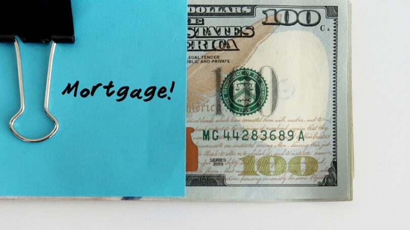Blue Paper Note Clipping On Cash Mortgage