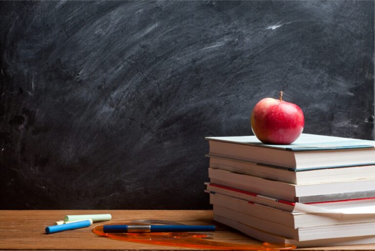 Classroom Teachers Desk Pile Of Textbooks Apple Chalkboard