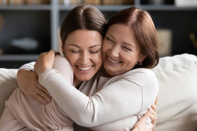 Mother Daughter Middle Aged Adult Child Hugging Smiling