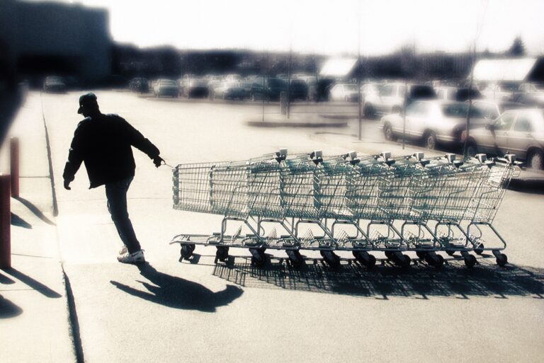 Man Collecting Shopping Carts Parking Lots