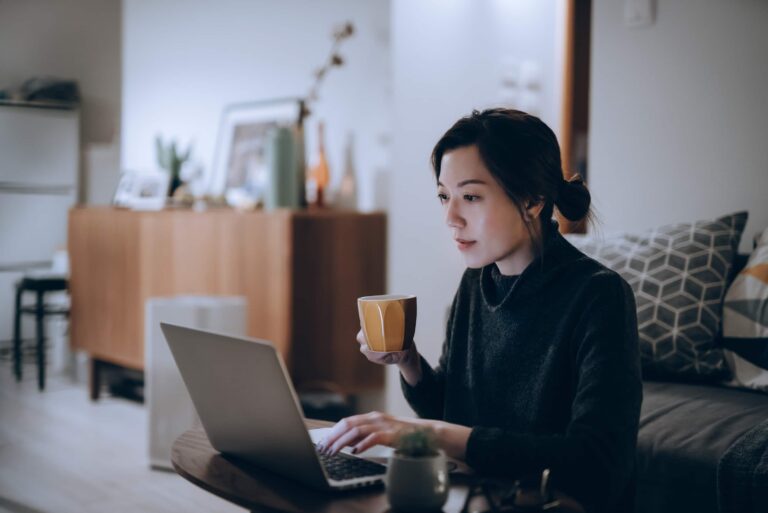 Woman Working Computer Drinking Coffee