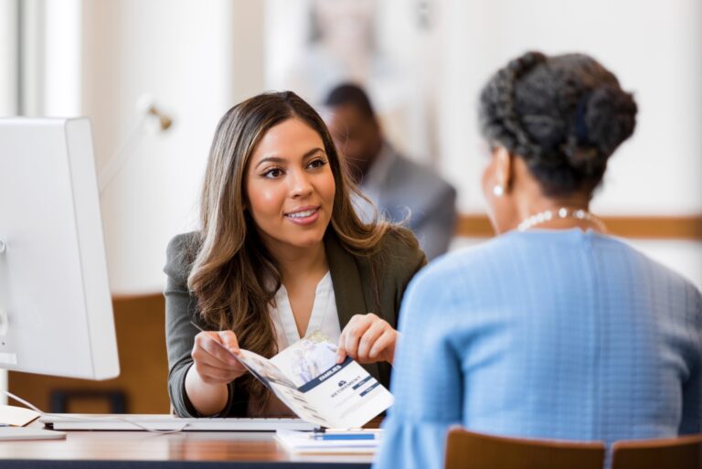 Bank Teller With Customer