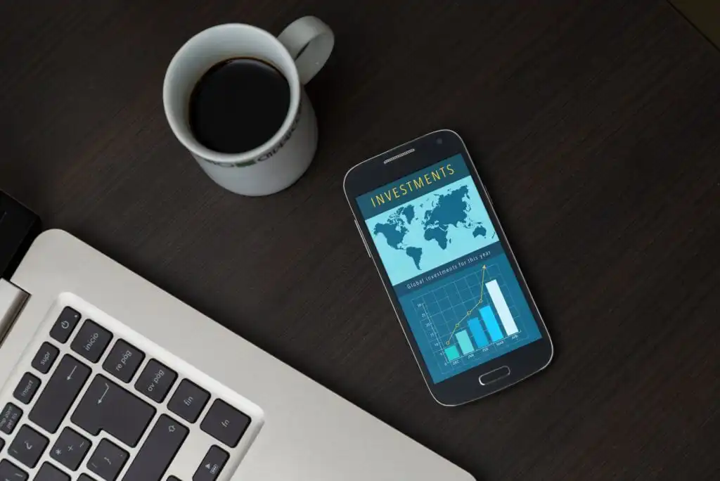 Phone Investment App Near Coffee Computer