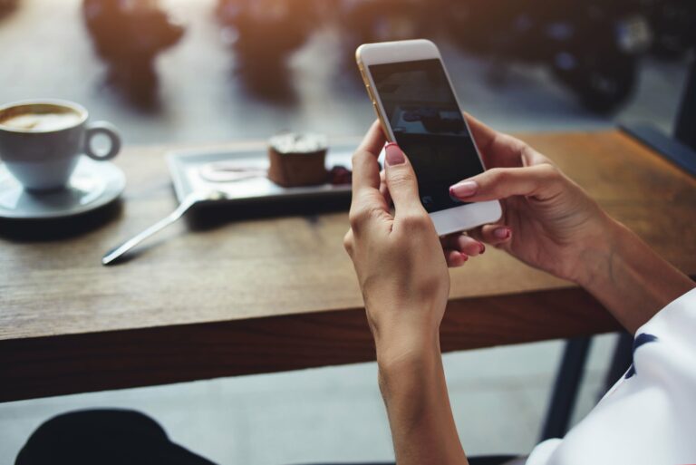 Woman Holding Smartphone Table Coffee