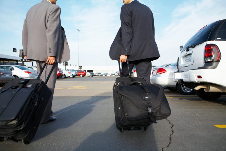 Businessmen Suitcases Parking Lot