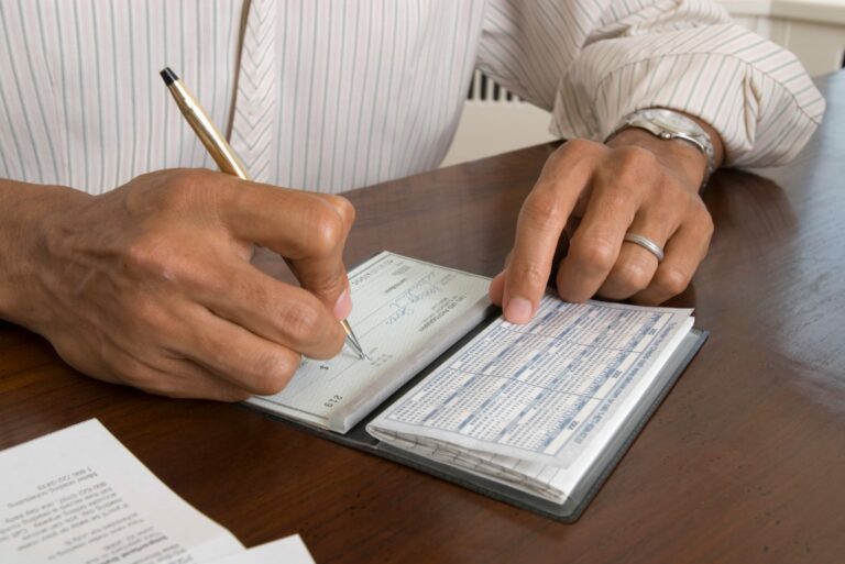 Man Writing Check Pen Desk