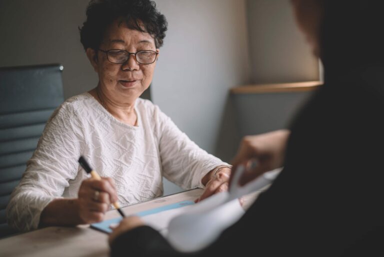 Senior Woman Reviewing Documents