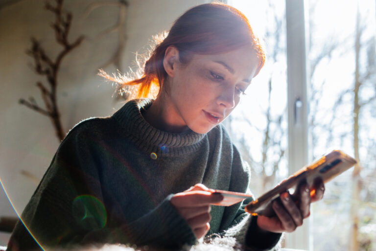 Woman Holding Credit Card Phone