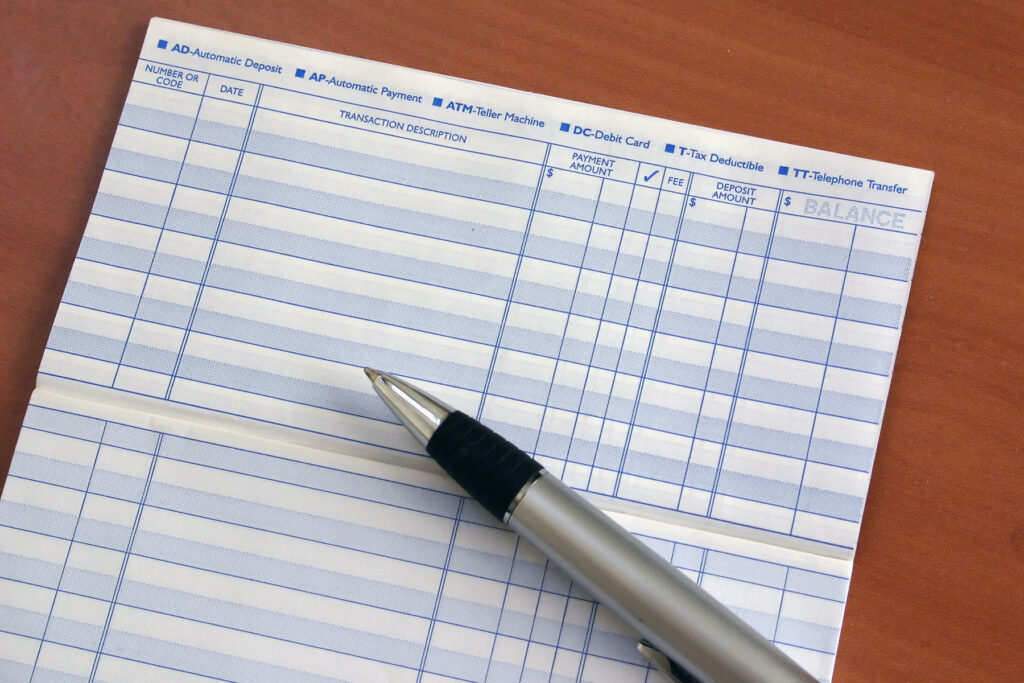 Registro de talão de cheques com caneta
