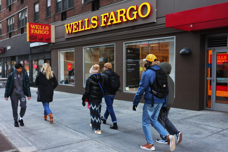 People Walking Past Wells Fargo Bank