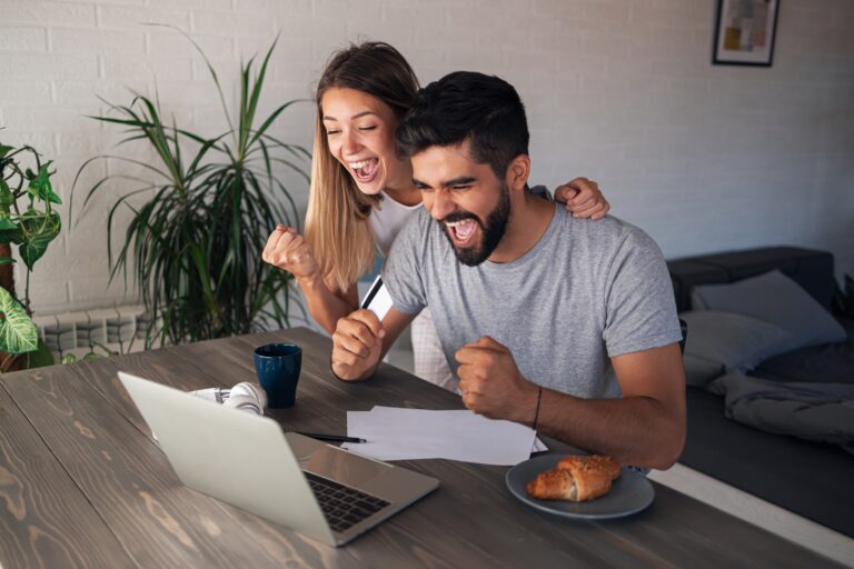 Couple Celebrating Credit Card Approval