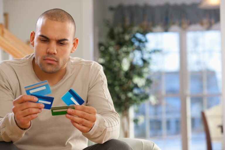 Guy Choosing Among Credit Cards