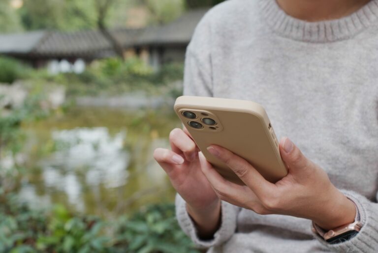 Woman On Smartphone Using One Of The Best Cash Advance Apps