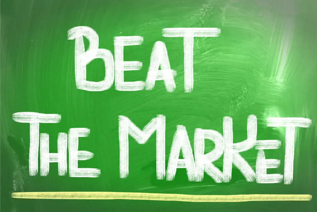 White chalk text on a green chalkboard reads Beat The Market, with a yellow line drawn beneath the words.