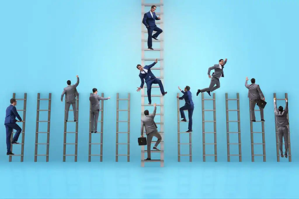 Several businesspeople in suits are climbing ladders of varying heights against a blue background, with one person at the top of the tallest ladder, symbolizing competition and career advancement.