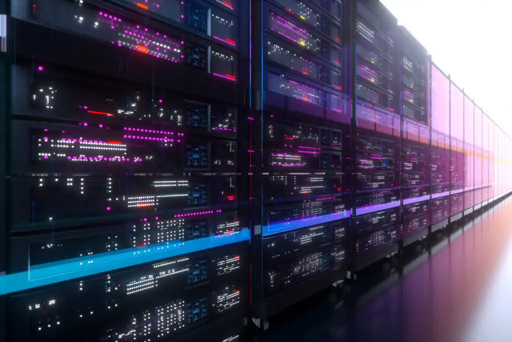 A row of modern data server racks with glowing pink, purple, and blue LED lights in a dimly lit, high-tech server room.