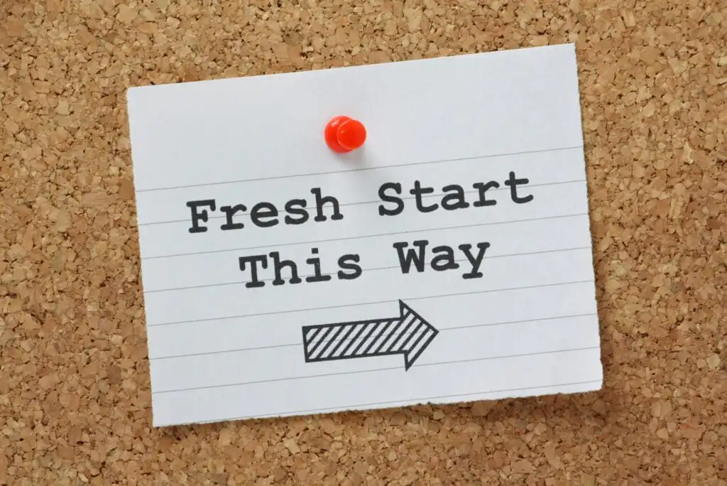 A note pinned to a corkboard reads Fresh Start This Way in bold black letters, with a right-pointing arrow below the text.