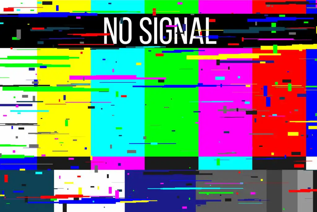 A colorful screen with digital glitches and static, showing the message NO SIGNAL in bold white letters at the top center. The image resembles a test pattern with pixelated distortion.