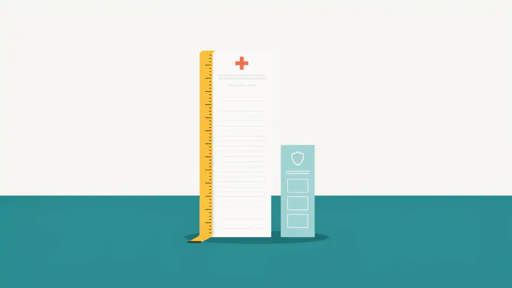 A tall medical bill stands beside a much shorter insurance statement, with a yellow tape measure running up the bill's edge.