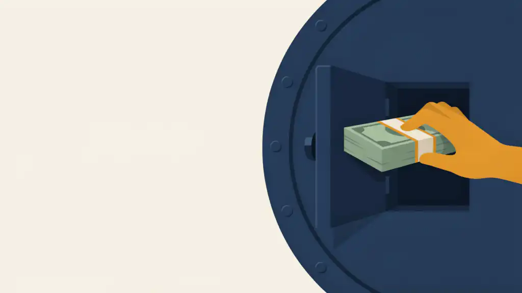 A navy vault door stays shut while a hand grips a banded stack of green bills in the small hatch standing open in it
