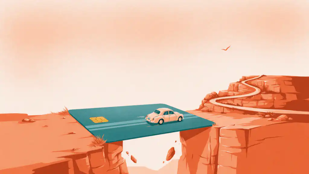 A small vintage car drives across a teal credit card laid as a bridge over a canyon between two cliffs