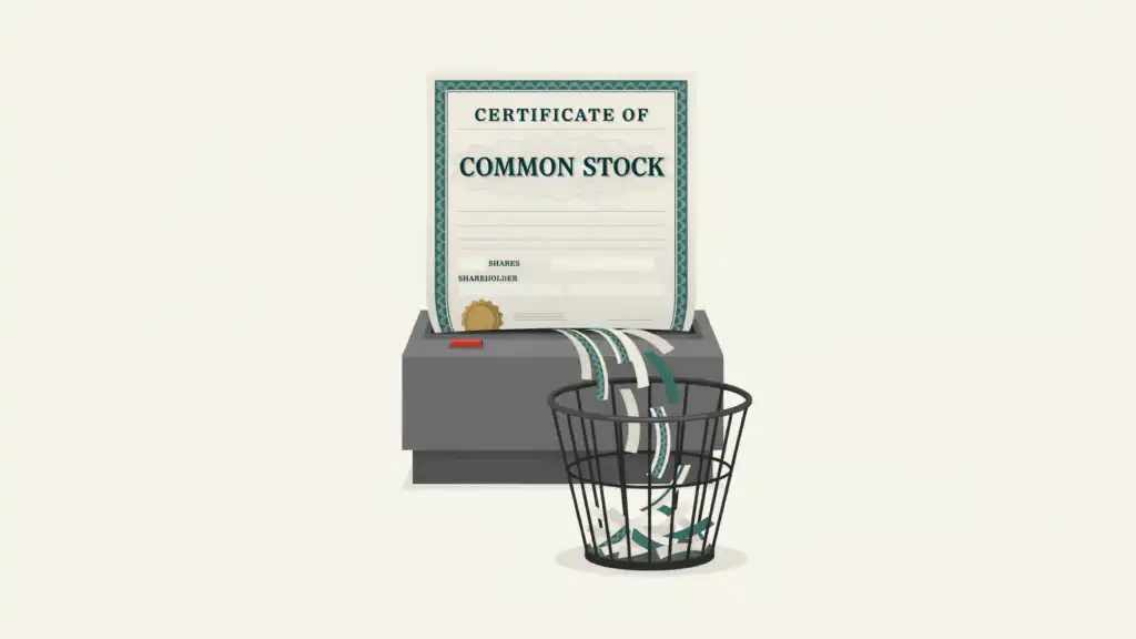 A stock certificate reading CERTIFICATE OF COMMON STOCK feeding into a gray shredder, its strips falling into a wire basket
