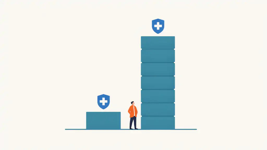 A figure looks up at a tower of seven teal blocks beside a single short block, each topped by a blue health shield