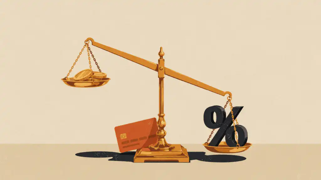 A brass scale tips under a heavy black percent sign that outweighs three gold coins, with an orange credit card at its base.