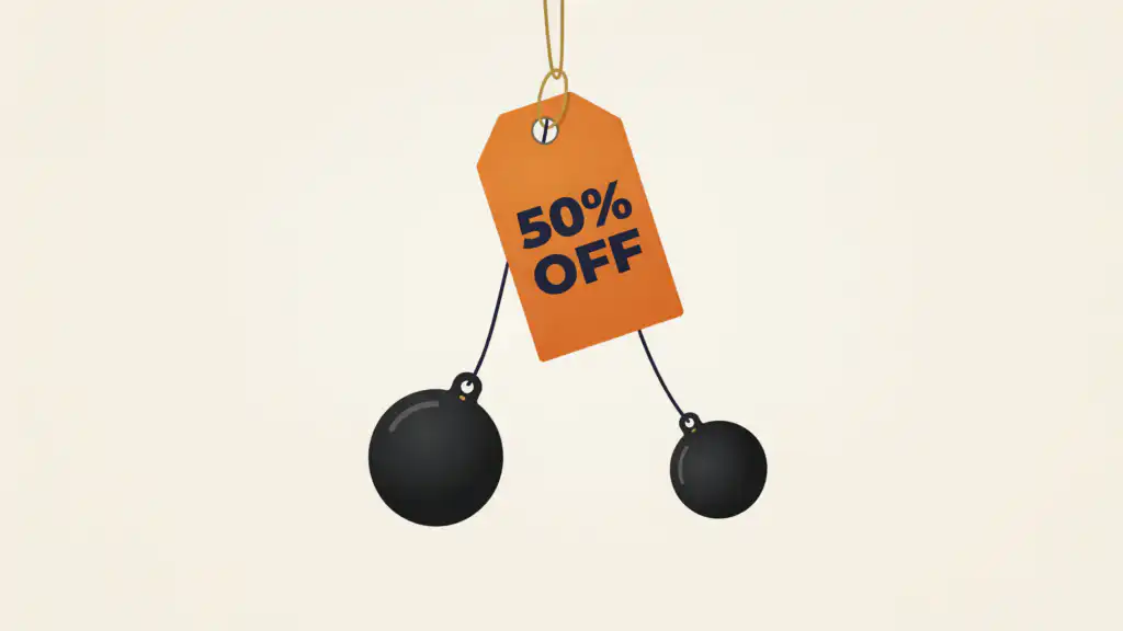 A price tag reading 50% OFF pulled down by two heavy iron weights, like the fees and taxes on a debt settlement.