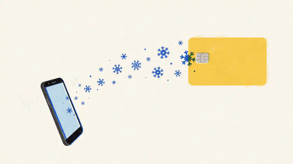 A stream of blue snowflakes flows from a smartphone screen into a yellow credit card
