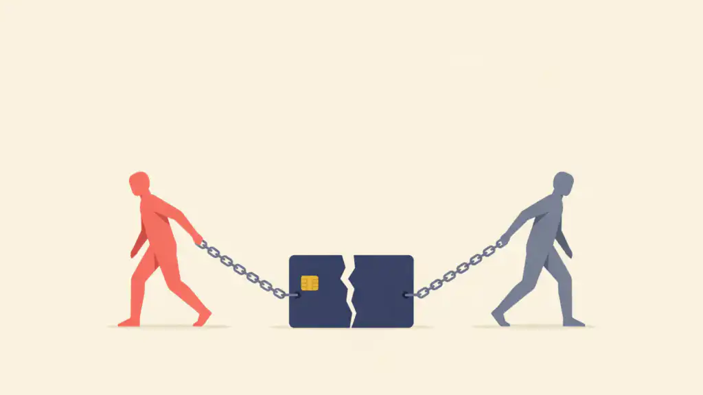 Two people walk away from each other, each still chained to one half of a cracked credit card