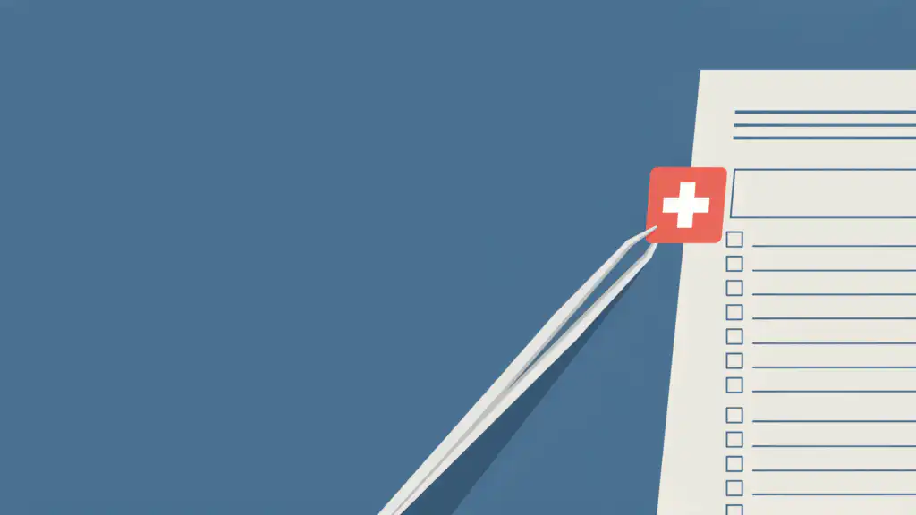 Tweezers lift a red tag with a white medical cross off the edge of a credit report sheet